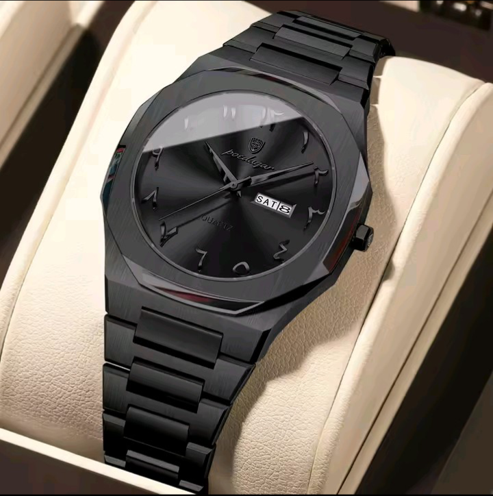 Black wristwatch with a detailed face on a beige cushion